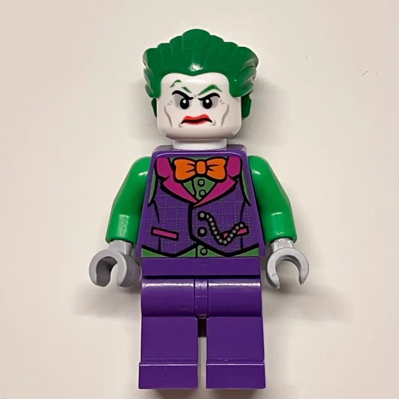 The Joker with Dark Purple Vest Over Green Shirt and Orange Bow Tie