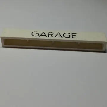 Brick 1 x 8 without Bottom Tubes with Cross Side Supports with 'GARAGE' Thin Narrow Black Print